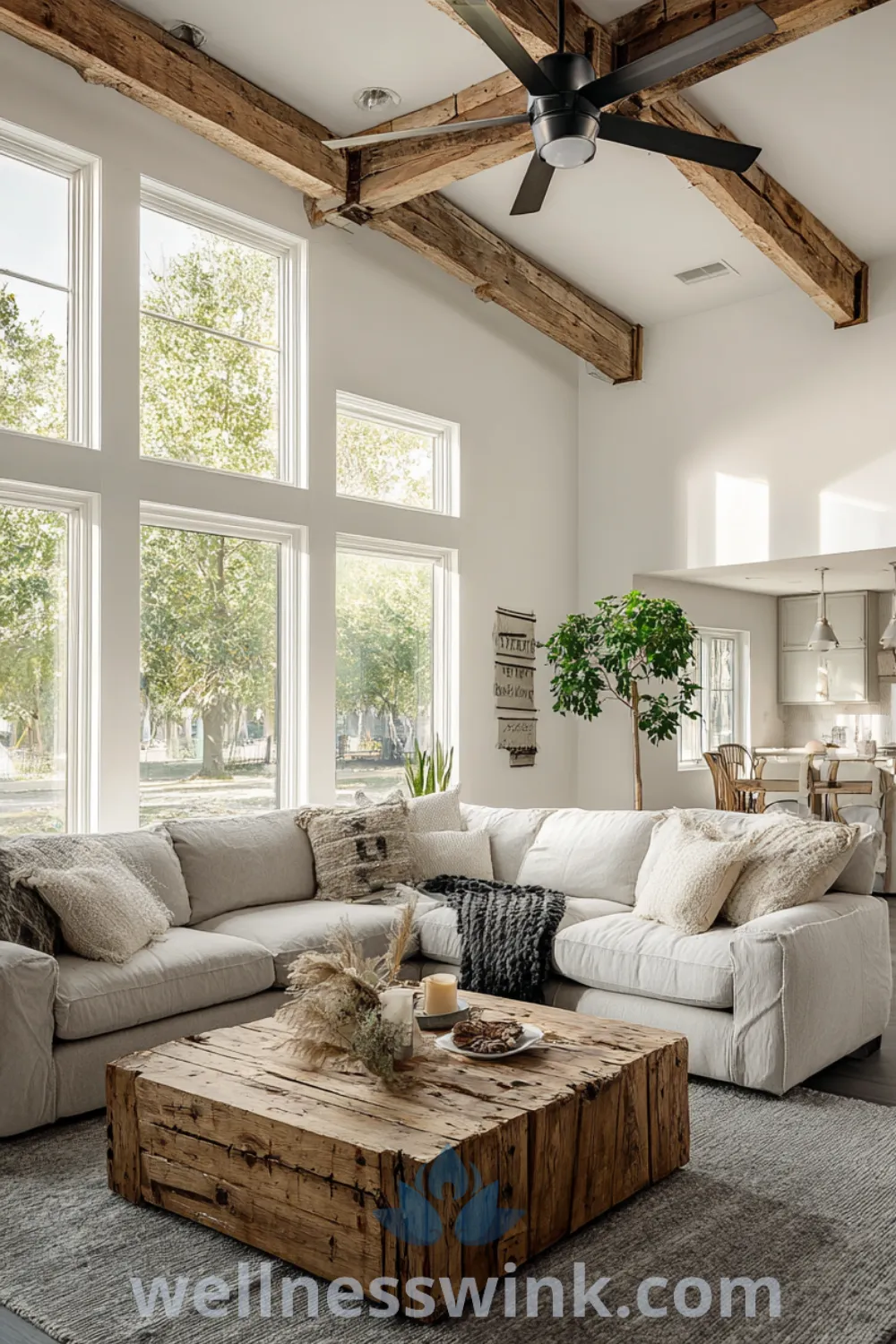 Spacious modern farmhouse living room features oversized sectional sofa, reclaimed wood coffee table, natural light, and cozy textures.